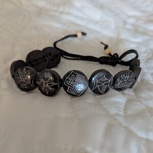 Black Beaded Bracelet with Engraved Symbols